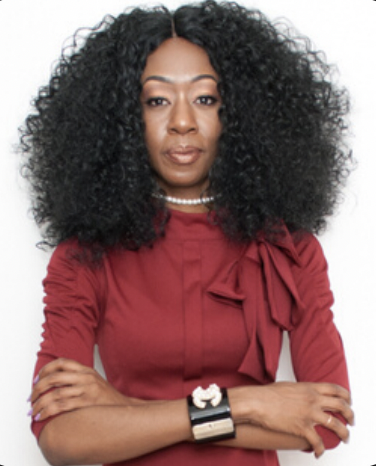 Ebony Noir portrait in a red top, arms crossed